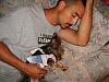 My hubby sleeping with his furbabies-s8002335.jpg