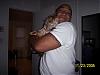 Let See Your "Big Men with Little Yorkie" Pictures!-devin-holding-pepper-r.jpg